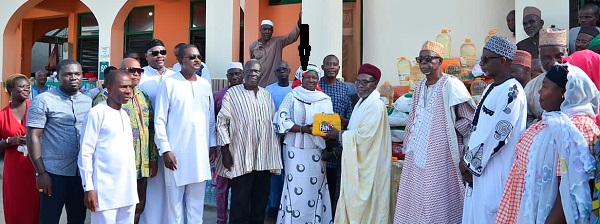  Prof. Naana Jane Opoku-Agyemang (arrowed), running mate of former President Mahama in the 2020 presidential election, handing over one of the donated items to a Muslim leader. With her are some NDC party leaders and some muslim chiefs in the Central Region